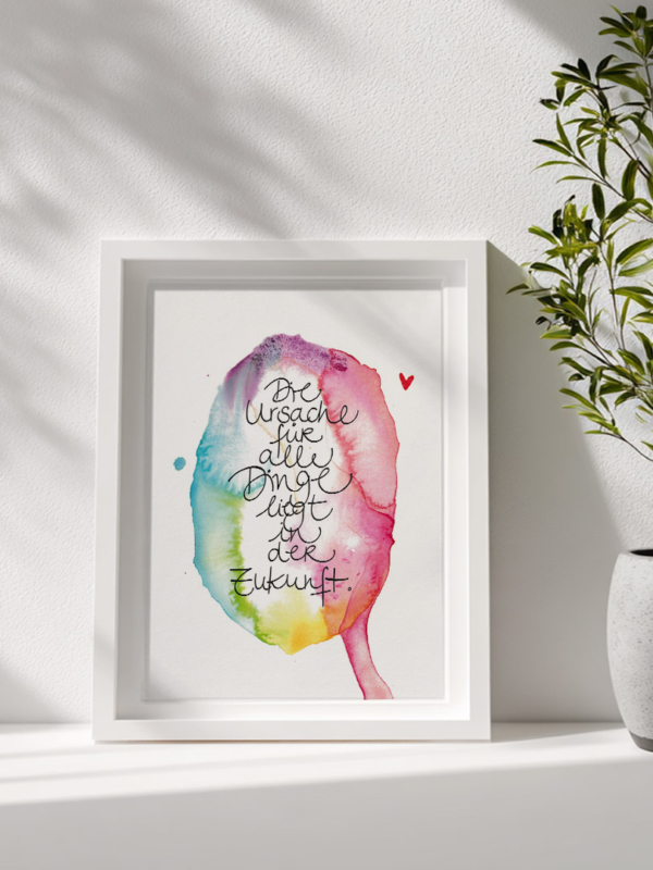 Kunstdruck eines Aquarells in lebendigen, ineinanderfließenden Farben – von kühlem Blau und Grün bis zu warmem Rot, Pink und Gelb. Im Zentrum steht in geschwungener, handgeschriebener Schrift der Satz: Die Ursache für alle Dinge liegt in der Zukunft.